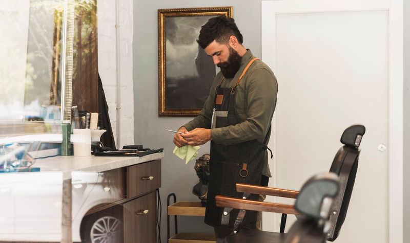 Modern hair salon interior with professional styling chairs and equipment