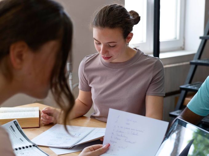 Tutor conducting educational session with student in learning environment