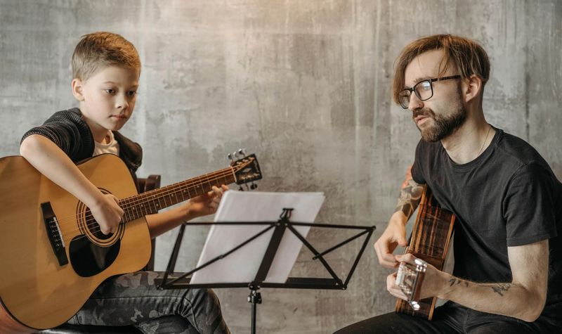 Music teacher with student in lesson
