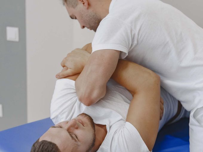 Chiropractor performing adjustment on patient