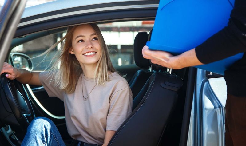 Driving instructor with student in car