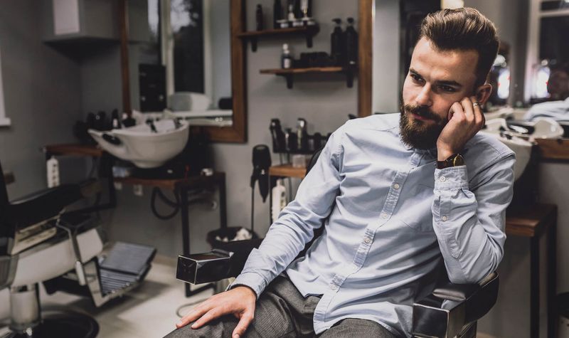 Professional barber shop interior with classic styling chairs
