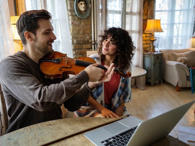Music teacher with student in lesson