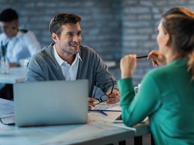 Professional consultant in business meeting with client