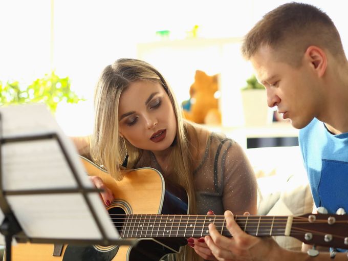 Music teacher with student in lesson