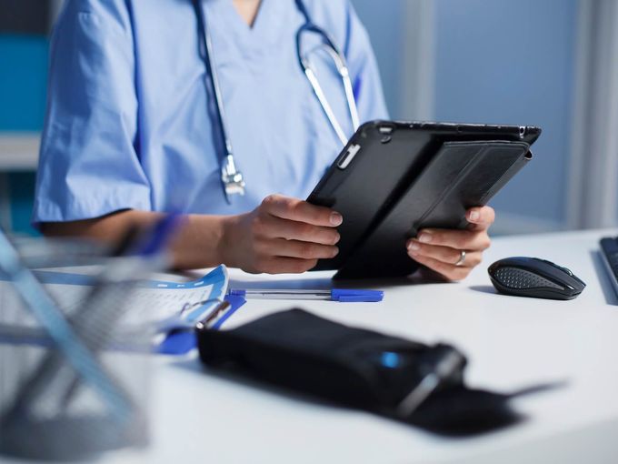 Medical professional in clinical setting providing healthcare services